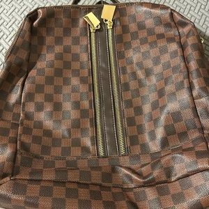 Brown and  checkered backpack